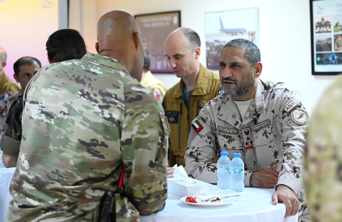 Amid Hassan M. Al Anazi, right, from the United Arab Emirates Air Force, and U.S. Air Force Col. Terence G. Taylor, 380th Air Expeditionary Wing commander, talk after a mission brief for Pégase 2023 at Al Dhafra Air Base, United Arab Emirates, June 25, 2023. During Pégase 2023, the French Air and Space Force are deploying 19 aircraft and 320 personnel to the Indo-Pacific region until Aug. 3, 2023. While there, French forces are scheduled to participate in multinational, large force exercises led by the U.S. Air Force and held with regional partners. (U.S. Air Force photo by Tech. Sgt. Alex Fox Echols III)