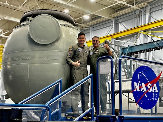 Image of two people posing for a photo.