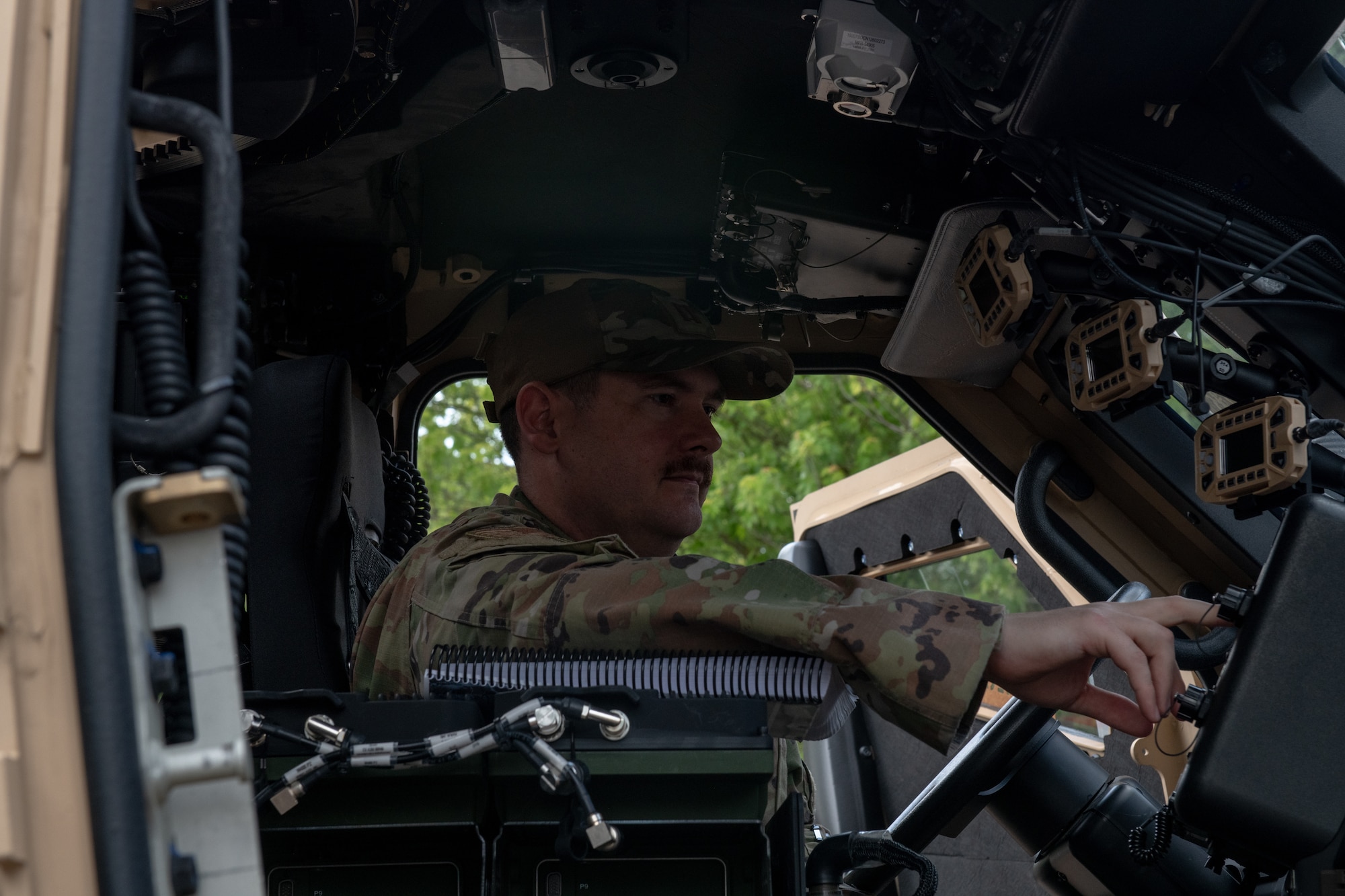 U.S. Air Force Capt. Michael Sanders, 48th Logistics Readiness Squadron vehicle maintenance flight commander, performs electronic checks in Joint Light Tactical Vehicle at RAF Lakenheath, England, June 22, 2023. The JLTVs, which will replace Humvees, will be used for daily operations in the vicinity of the flightline, providing increased operational security for the Liberty Wing. (U.S. Air Force photo by Airman Delanie Brown)