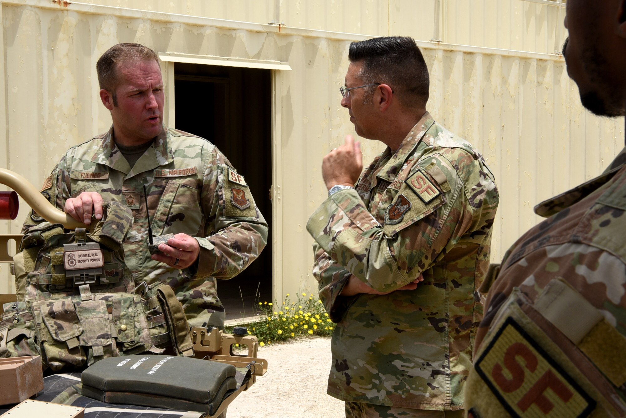 U.S. Air Force Master Sgt. Shannon Fulmer, 7th Security Forces Squadron plans and programs superintendent, showcases new technology to Brig. Gen. Thomas Sherman, Security Forces director, at Dyess Air Force Base, Texas, June 15, 2023. Sherman visited Dyess to present the 7th SFS with the Air Force Best Medium Sized Security Forces Squadron Award along with seeing new innovations including the robotic dog, a new GPS system, upgraded flack vests and more. (U.S. Air Force photo by Senior Airman Sophia Robello)
