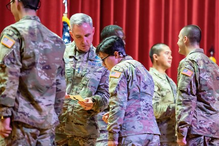 Lt. Gen. Stephen N. Whiting, Space Operations Command commander, speaks with a Guardian during the U.S. Space Force patching ceremony at basic military training June 20, 2023.