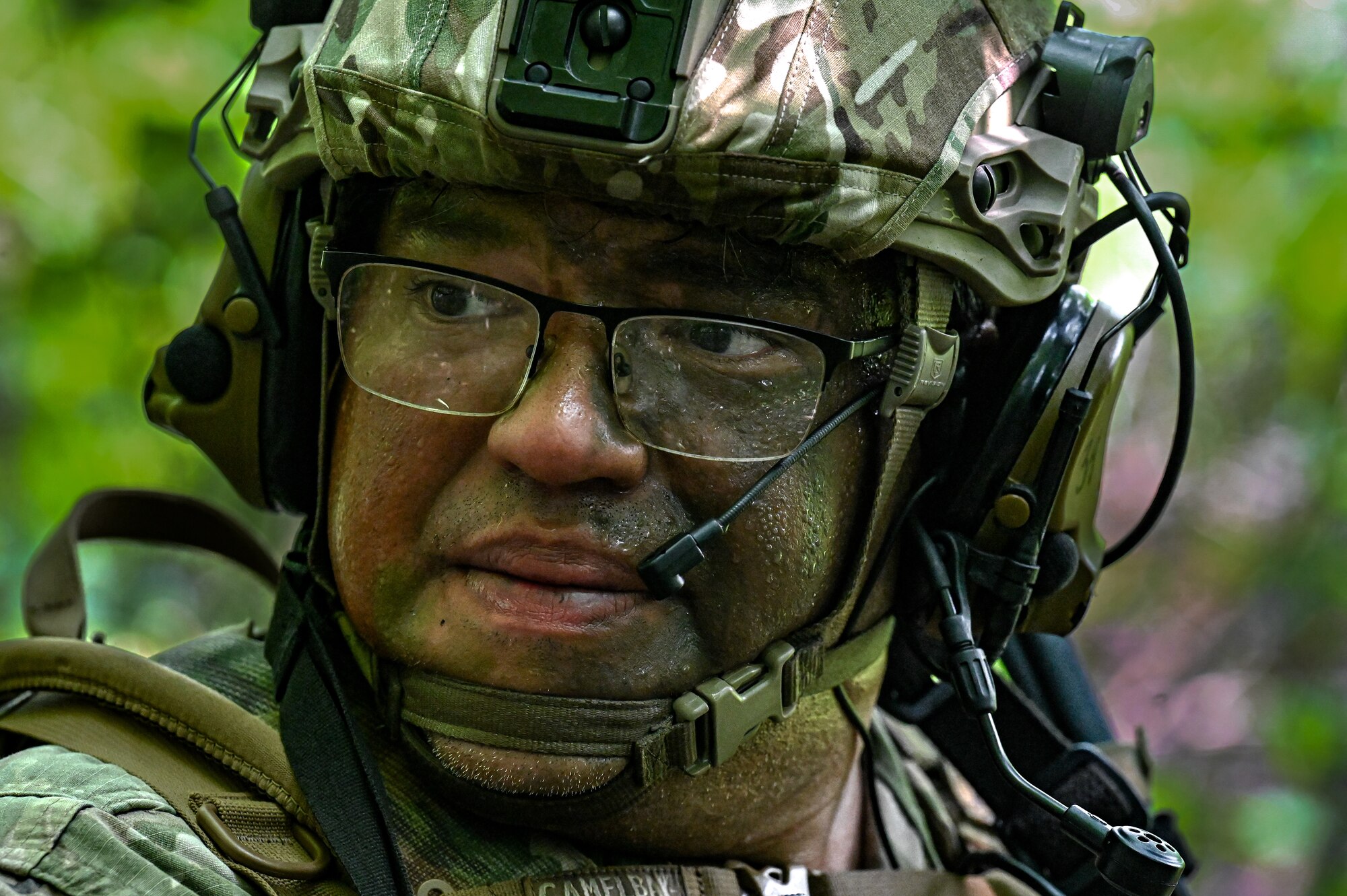 Tech. Sgt. Carlos Ruiz, a Defender assigned to the 301st Security Forces Squadron, Carswell Field, Naval Air Station Joint Reserve Base Fort Worth, Texas, looks back to signal his fellow Defenders to move on June 15, 2023, at Camp James A. Garfield Joint Military Training Center, Ohio.