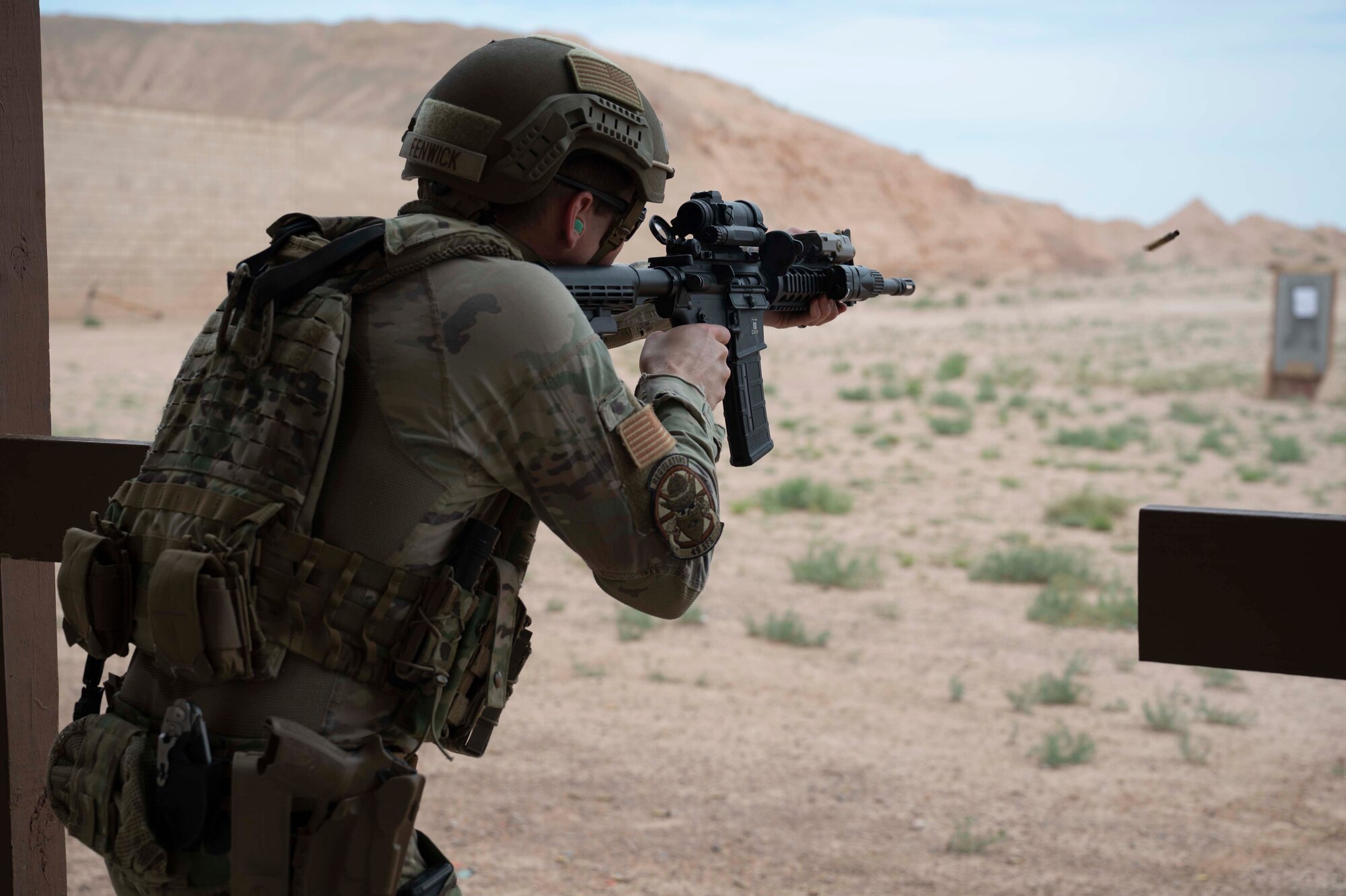 U.S. Air Force Staff Sgt. Lucas Fenwick, 49th Security Forces Squadron Base Defense Operations Center controller, fires an M4A1 rifle at Holloman Air Force Base, New Mexico, June 9, 2023. The candidates were evaluated on their marksmanship skills to determine who would be selected for official SRT training at Fort Leonard Wood, Missouri. (U.S. Air Force photo by Airman 1st Class Michelle Ferrari)