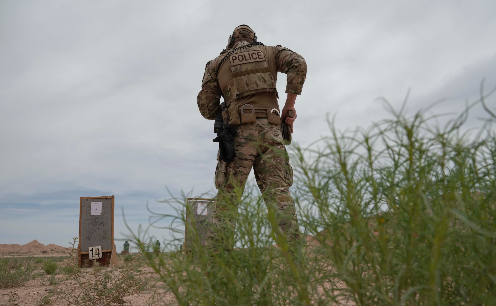 U.S. Air Force Capt. Jared Hafich, 49th Security Forces Squadron operations officer, gets ready to fire his SIG M18 at a target at Holloman Air Force Base, New Mexico, June 9, 2023. Pistol qualifications enable airmen to enhance their shooting skills and maintain proficiency with a sidearm. (U.S. Air Force photo by Airman 1st Class Michelle Ferrari)