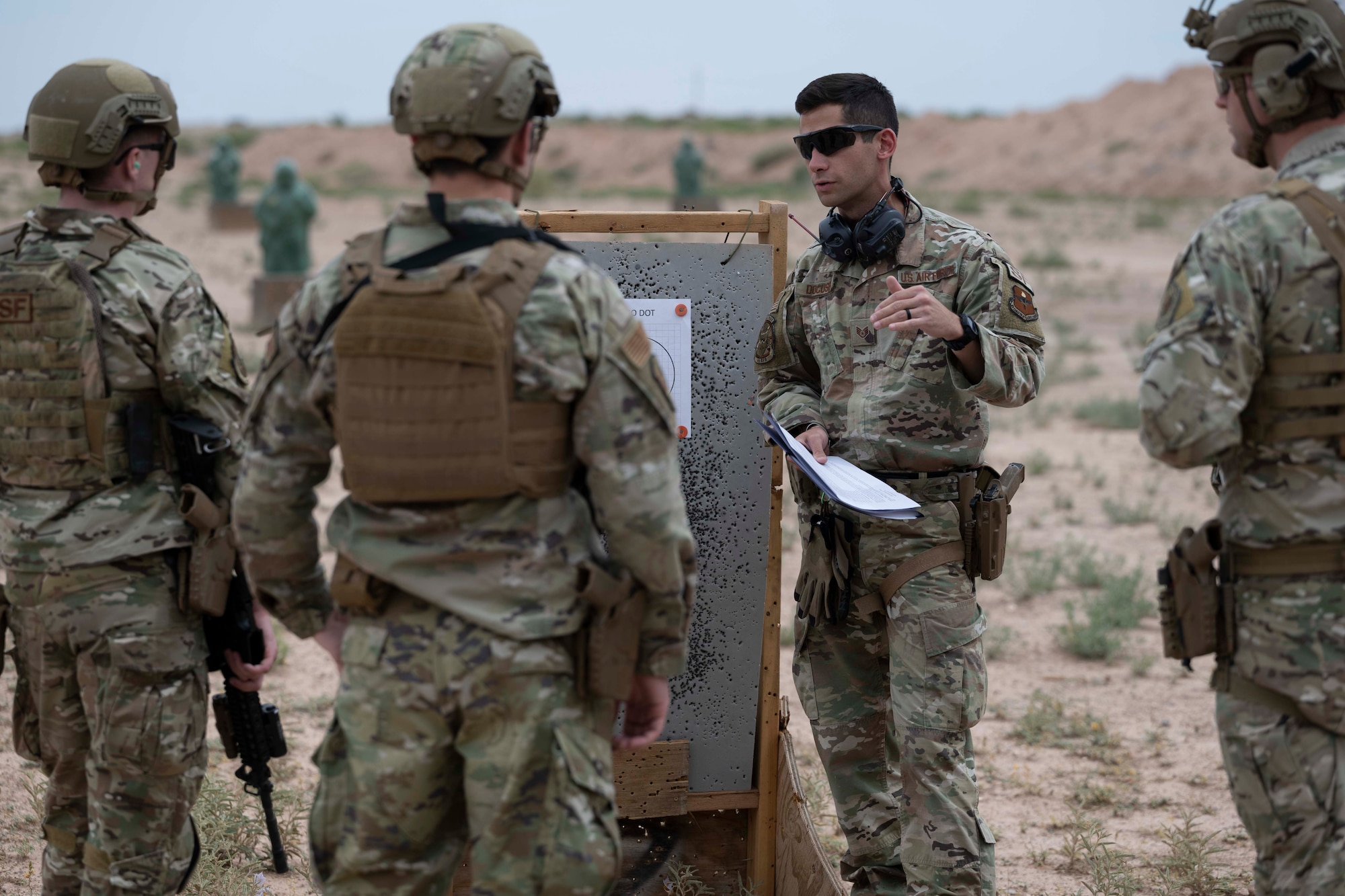 U.S. Air Force Staff Sgt. Chandler Docusen,  49th Security Forces Squadron unit trainer, prepares Special Reactions Team candidates for competition at Holloman Air Force Base, New Mexico, June 9, 2023. Special Reactions Team tryouts determine the capability and accuracy of Airmen who are qualified to handle high-risk crisis situations.  (U.S. Air Force photo by Airman 1st Class Michelle Ferrari)