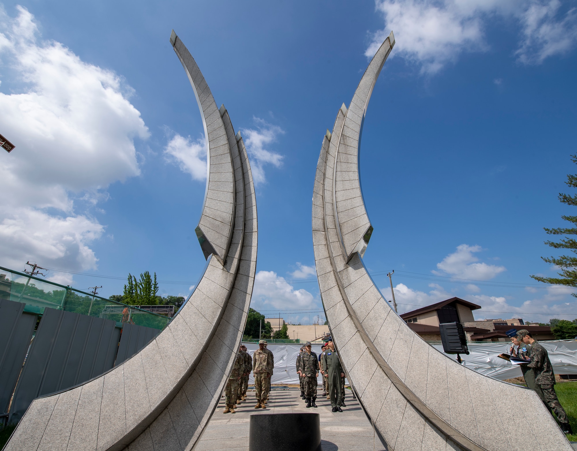 U.S. and Republic of Korea troops stand in formation during a memorial ceremony at Osan Air Base, ROK, June 22, 2023. Before the ceremony, the troops cleaned the memorial site with brushes, brooms and wipes to pay respects to those who made the ultimate sacrifice during the Korean War. (U.S. Air Force photo by Senior Airman Aaron Edwards)