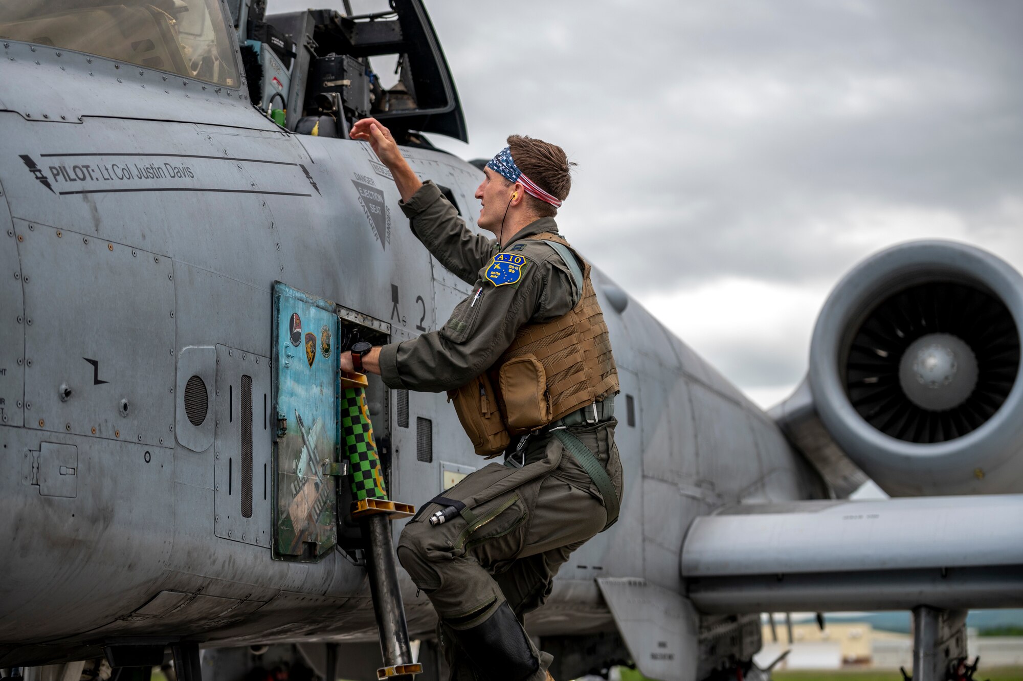 U.S. Air Force Capt. Zachary Kocur, 25th Fighter Squadron pilot, climbs into an A-10C Thunderbolt II during the first day of Red Flag Alaska 23-2 at Eielson Air Force Base, Alaska, June 9, 2023.