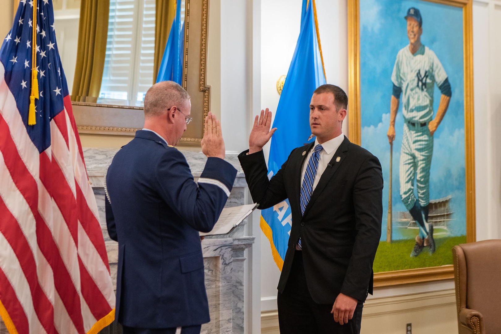 U.S. Air Force Maj. Rex Alan Star, left, Arkansas Air National Guard, issues the oath of enlistment to Tom Woods, an Oklahoma state senator, at the Oklahoma State Capitol on June 26, 2023, Oklahoma City. Woods said he enlisted into the Oklahoma ANG for the opportunity to serve more Oklahomans than who he currently serves in his congressional district. (U.S. Air National Guard photo by Airman Erika Chapa)