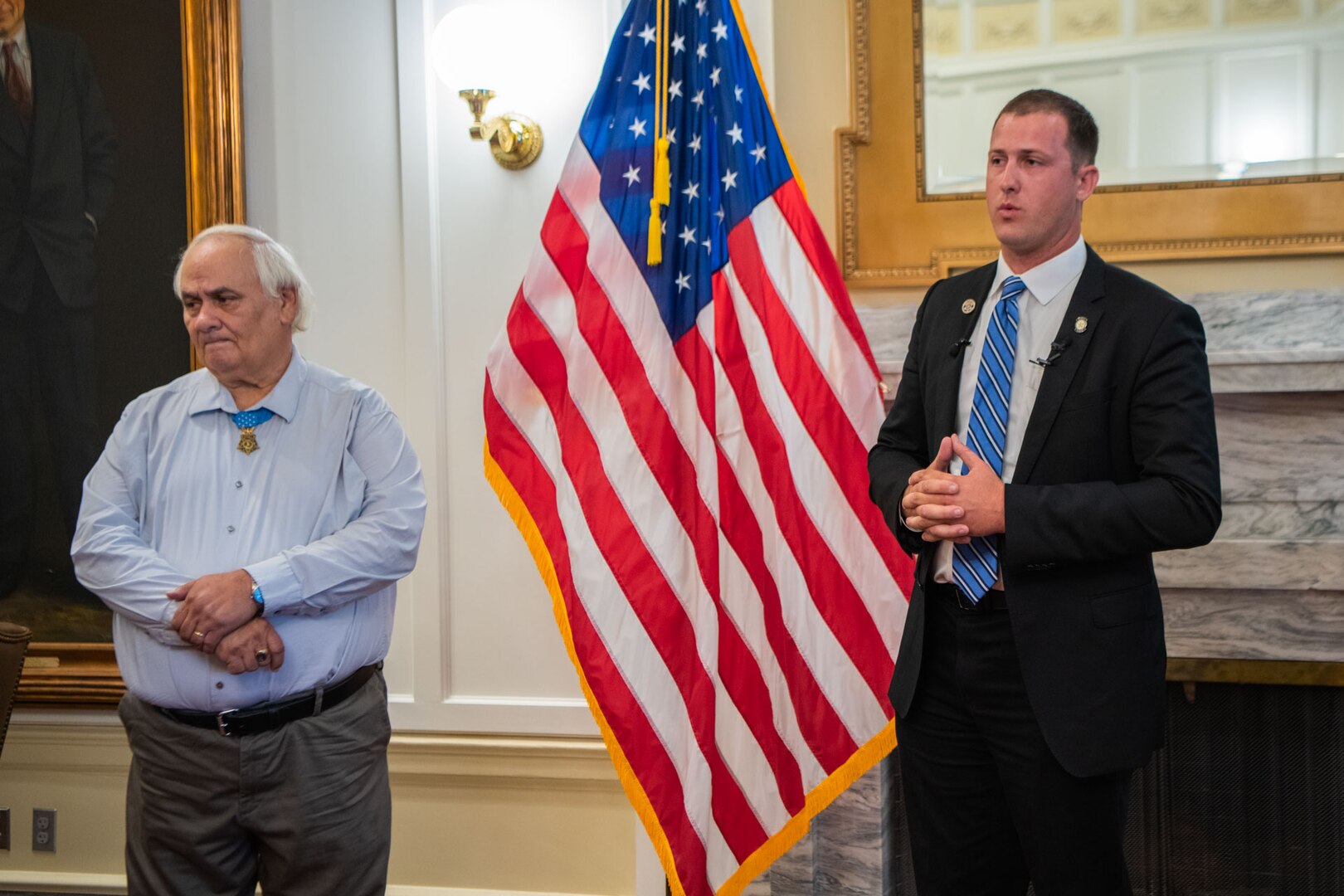 Tom Woods, an Oklahoma state senator, right, introduces former U.S. Army Spc. 5 Dwight W. Birdwell, a Medal of Honor recipient, after taking his oath of enlistment into the Oklahoma Air National Guard at the Oklahoma State Capitol on June 26, 2023, Oklahoma City. Birdwell earned two purple hearts, a Bronze Star for meritorious service and two Silver Stars during the course of his service in the Vietnam War. (U.S. Air National Guard photo by Airman Erika Chapa)