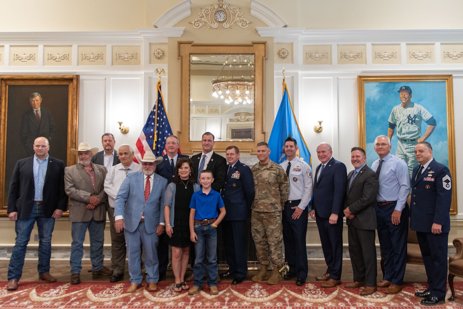 Tom Woods, an Oklahoma state senator, is accompanied by guests at his enlistment ceremony at the Oklahoma State Capitol on June 26, 2023, Oklahoma City. Woods enlisted into the Oklahoma ANG to serve beyond his congressional district and will attend Air Force basic military training and security forces technical training between state senate sessions. (U.S. Air National Guard photo by Airman Erika Chapa)