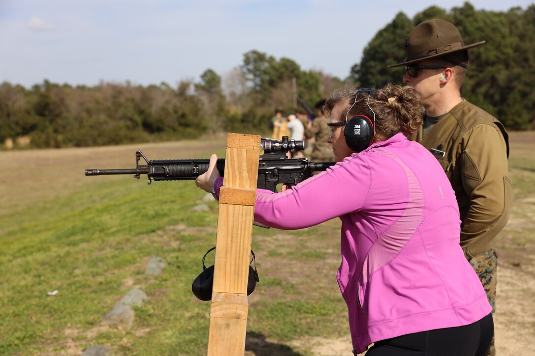 U.S. Marine Sgt. Mitchell Edds, right, a primary marksmanship instructor on Parris Island,  educates Mariana Quintana, a teacher at Woodson high school, on marksmanship fundamentals at the rifle range during the Educators Workshop on Marine Corps Recruit Depot, Parris Island, South Carolina, Feb. 23, 2023. The workshop offers teachers, coaches, school administrators, and community influencers the opportunity to learn about the process to become a United States Marine and to educate them on benefits and opportunities associated with the Marine Corps.

(U.S. Marine Corps photo by Staff Sgt. Ryan Sammet)