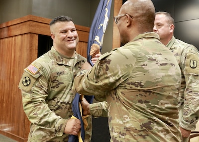 Illinois Army National Guard Col. Shawn Nokes accepts the 129th Regiment guidon from Maj. Gen. Rodney Boyd, the Commander of the Illinois Army National Guard. Nokes of Springfield assumed command of the 129th Regiment (Regional Training Institute) at the unit's headquarters in the Illinois Military Academy on Camp Lincoln in Springfield on June 10.