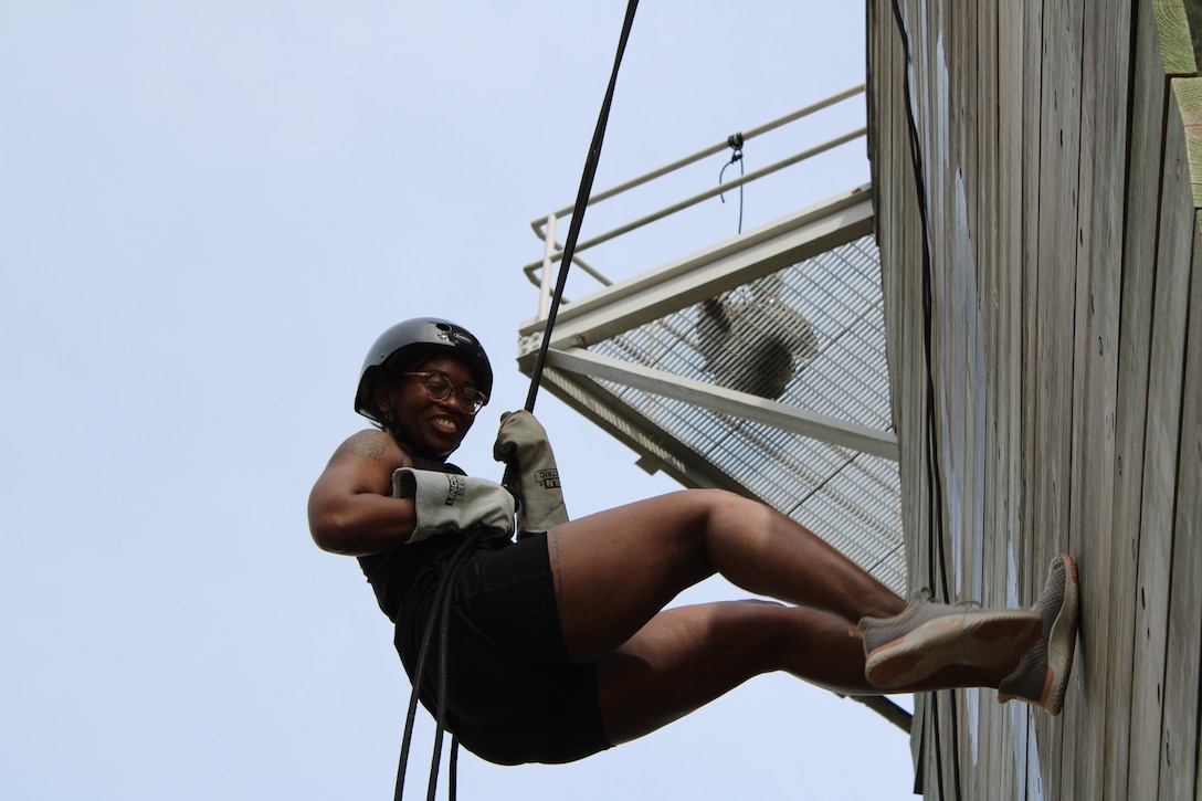 Ashleigh Currie, an educator with Millington County Schools, rappels down the rappel tower during Educators Workshop at Marine Corps Recruit Depot Parris Island, South Carolina, March 2, 2023. The purpose of the workshop is to inform high school educators and community influencers about the process of becoming a United States Marine, and to raise awareness of the opportunities and benefits for qualified individuals in the Marine Corps.  (U.S. Marine Corps photo by Sgt. Andrew Hiatt)