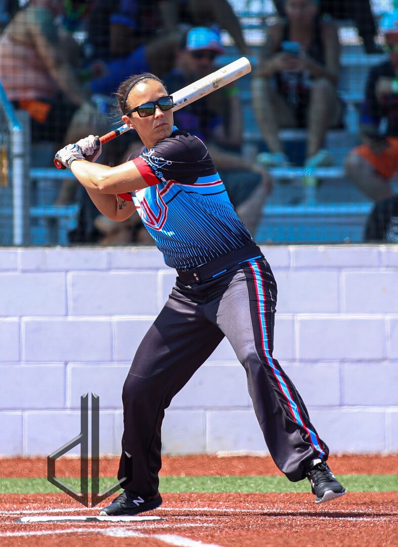 Illinois Army National Guard Sgt. 1st Class Mary Joan “MJ” Patten prepares to swing during an at-bat with the military women’s slow pitch softball team she plays on. On July 18, Patten will report to Fort Sill, Oklahoma, to compete in the All-Army Women’s Softball training camp. (Photo provided by David Luberti Photography)