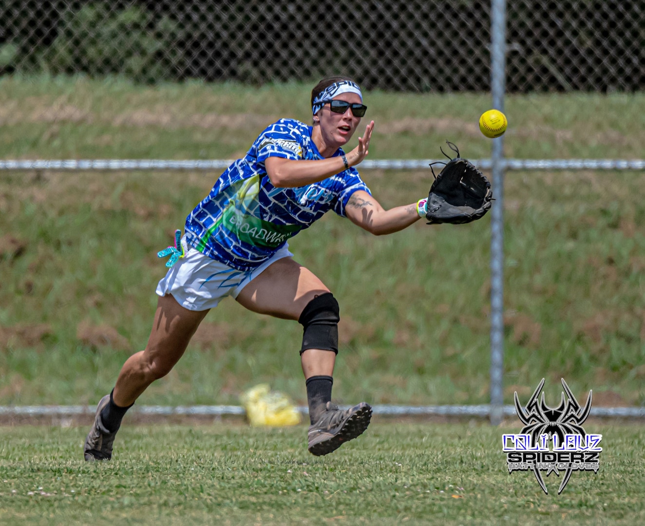 Illinois Army National Guard Sgt. 1st Class Mary Joan “MJ” Patten reaches for the ball during a slow pitch softball tournament in which she was participating. On July 18, Patten will report to Fort Sill, Oklahoma, to compete in the All-Army Women’s Softball training camp. (Photo by Cali Love Photography)