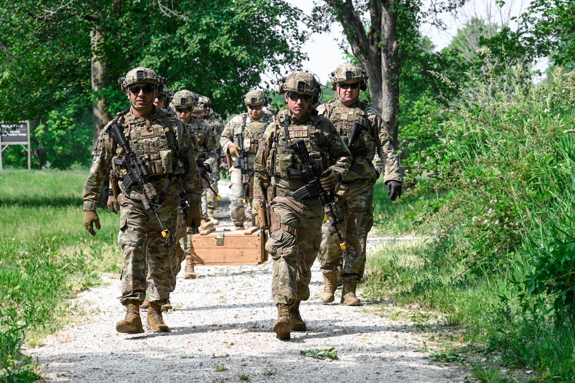 Integrated Defense Leadership Course students carry a box of spent training grenades on June 7, 2023, at Camp James A. Garfield Joint Military Training Center, Ohio.