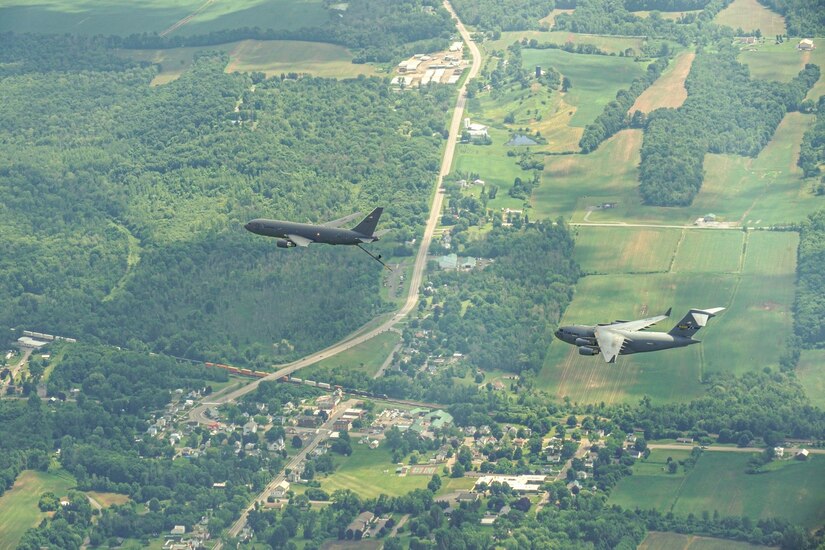 Two KC-46A Pegasus and a C17 Globemaster III’s fly in formation during Operation Centennial Contact at Joint Base McGuire-Dix-Lakehurst, N.J., June 27, 2023.