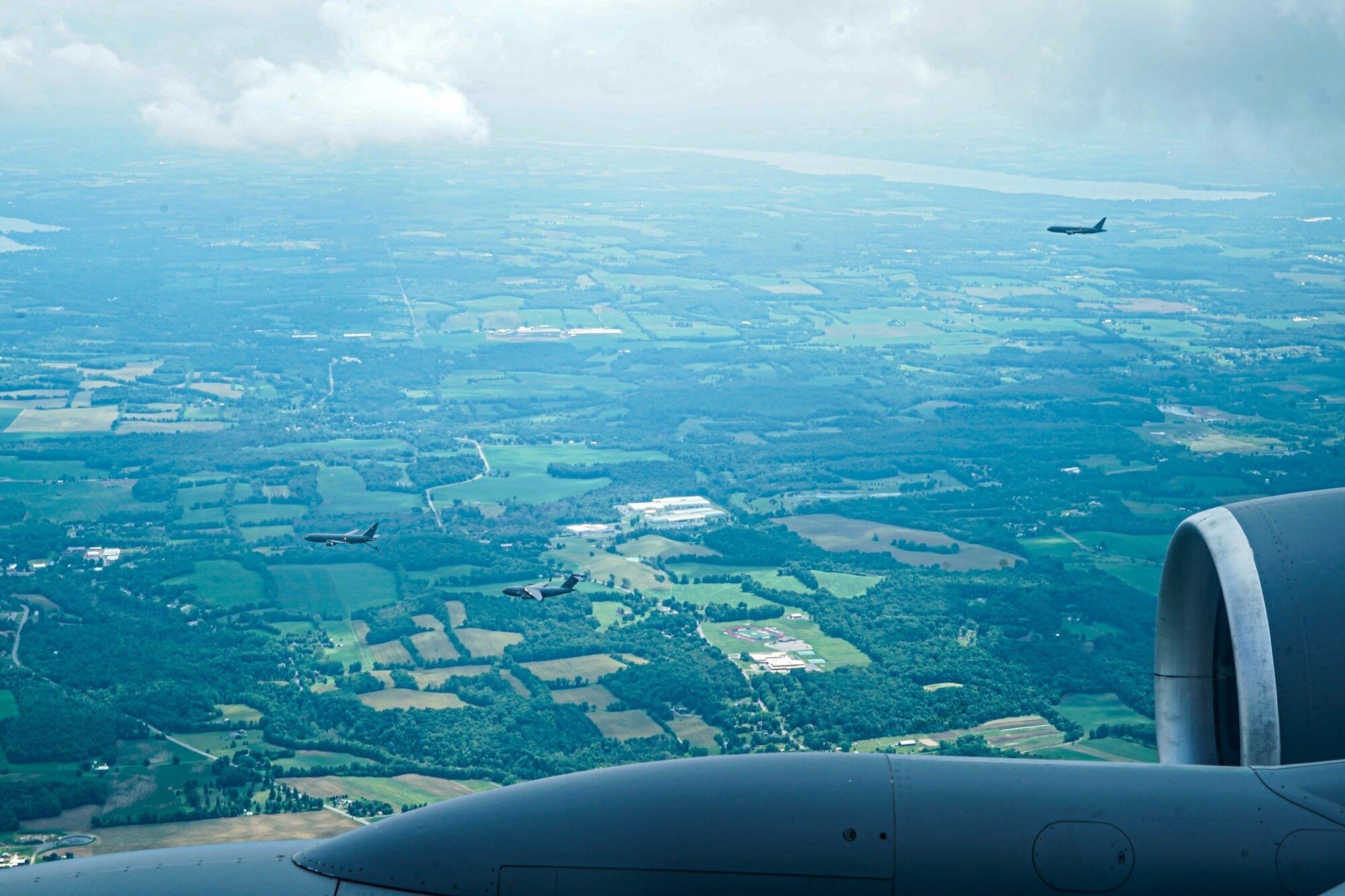 Two KC-46A Pegasus and a C17 Globemaster III’s fly in formation during Operation Centennial Contact at Joint Base McGuire-Dix-Lakehurst, N.J., June 27, 2023.