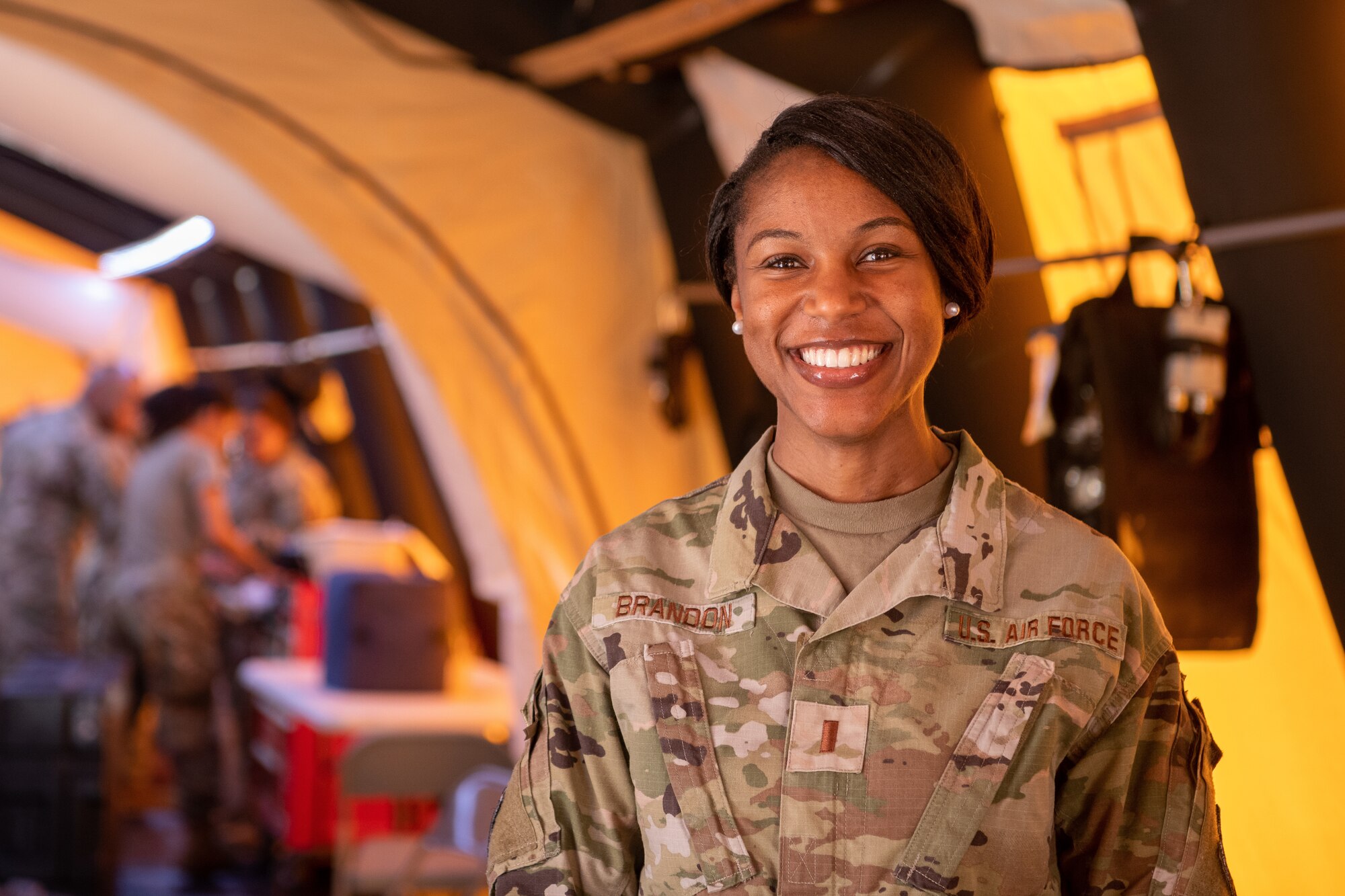 photo of person standing inside medical tent