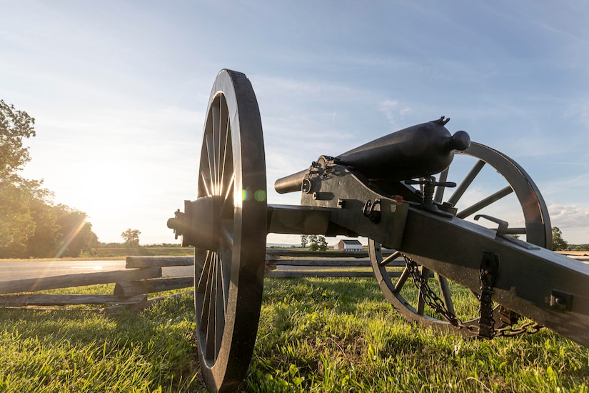 A Civil War-era cannon faces toward the sunrise.