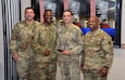 Shortly before his active-duty retirement, Master Sgt. Wesley Ladlee, center right, receives the prestigious Dean R. Ohlsen Award of Excellence during a ceremony June 1, 2023, at Fort Detrick, Maryland. Also pictured are U.S. Army Medical Logistics Command leaders, from left, Command Chief Warrant Officer 5 Lee Nelson, Commander Col. Gary Cooper and Sgt. Maj. Akram Shaheed.