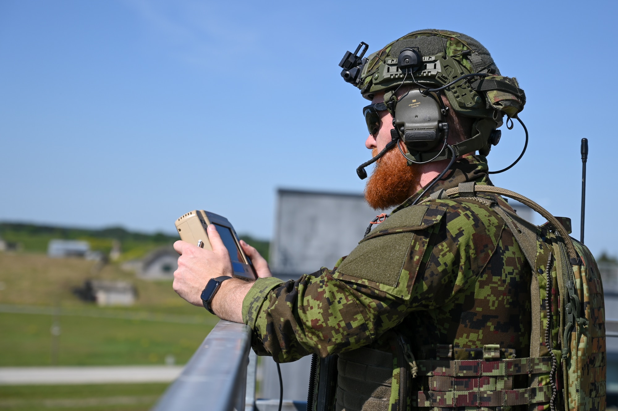An Estonian joint terminal attack controller monitors aerial surveillance from a U.S. Air Force A-10C Thunderbolt II aircraft assigned to the 104th Fighter Squadron, 175th Wing, Maryland National Guard, June 14, 2023, during a training sortie at Tapa Army Base, Estonia.