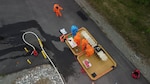 Members of the Mississippi National Guard's 47th Weapons of Mass Destruction - Civil Support Team process through a decontamination line June 14, 2023, in Wasilla, Alaska, as part of ORCA 2023. The exercise increased interoperability among a range of agencies, including the Alaska National Guard’s 103rd Weapons of Mass Destruction-Civil Support Team, 12 National Guard units, eight local and state agencies, three federal organizations, and community partners.