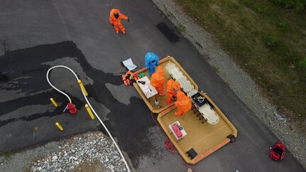 Members of the Mississippi National Guard's 47th Weapons of Mass Destruction - Civil Support Team process through a decontamination line June 14, 2023, in Wasilla, Alaska, as part of ORCA 2023. The exercise increased interoperability among a range of agencies, including the Alaska National Guard’s 103rd Weapons of Mass Destruction-Civil Support Team, 12 National Guard units, eight local and state agencies, three federal organizations, and community partners.