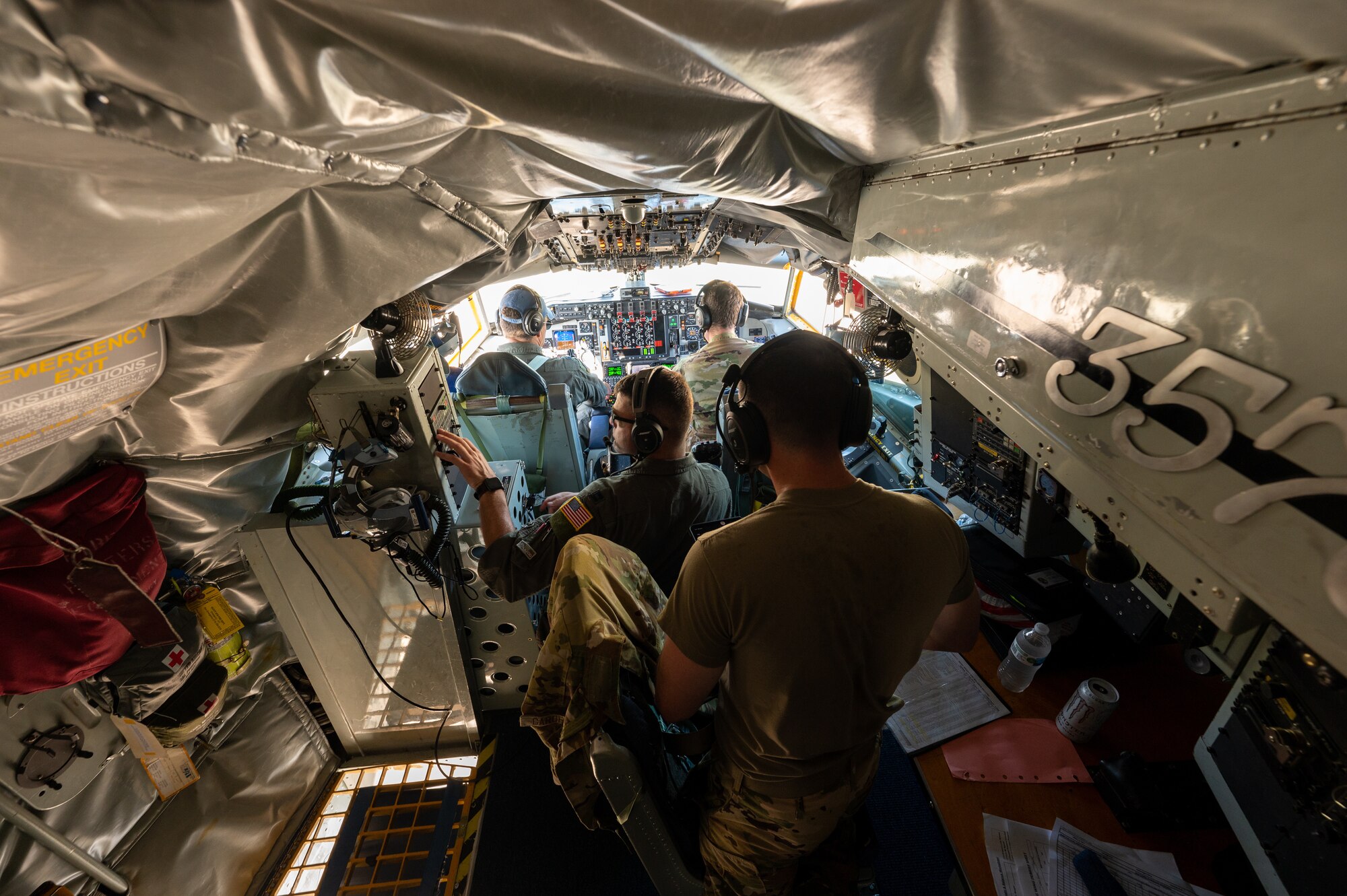 Pilots inspect the inside of an aircraft