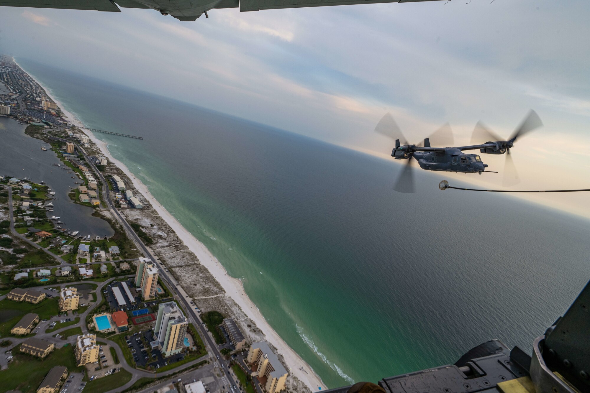 A CV-22 Osprey refuels from a MC-130J Commando II over the Emerald Coast.