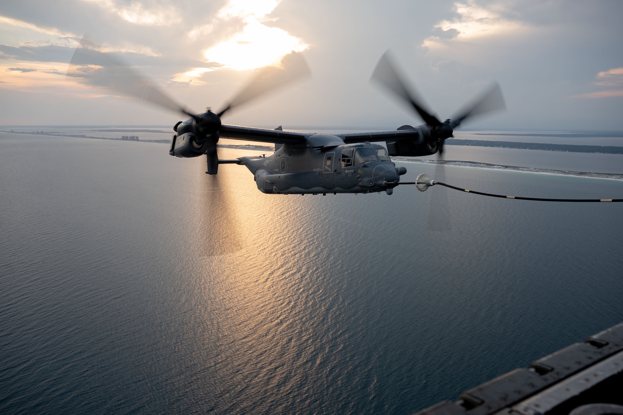 A CV-22 Osprey refuels from a MC-130J Commando II over the Emerald Coast.