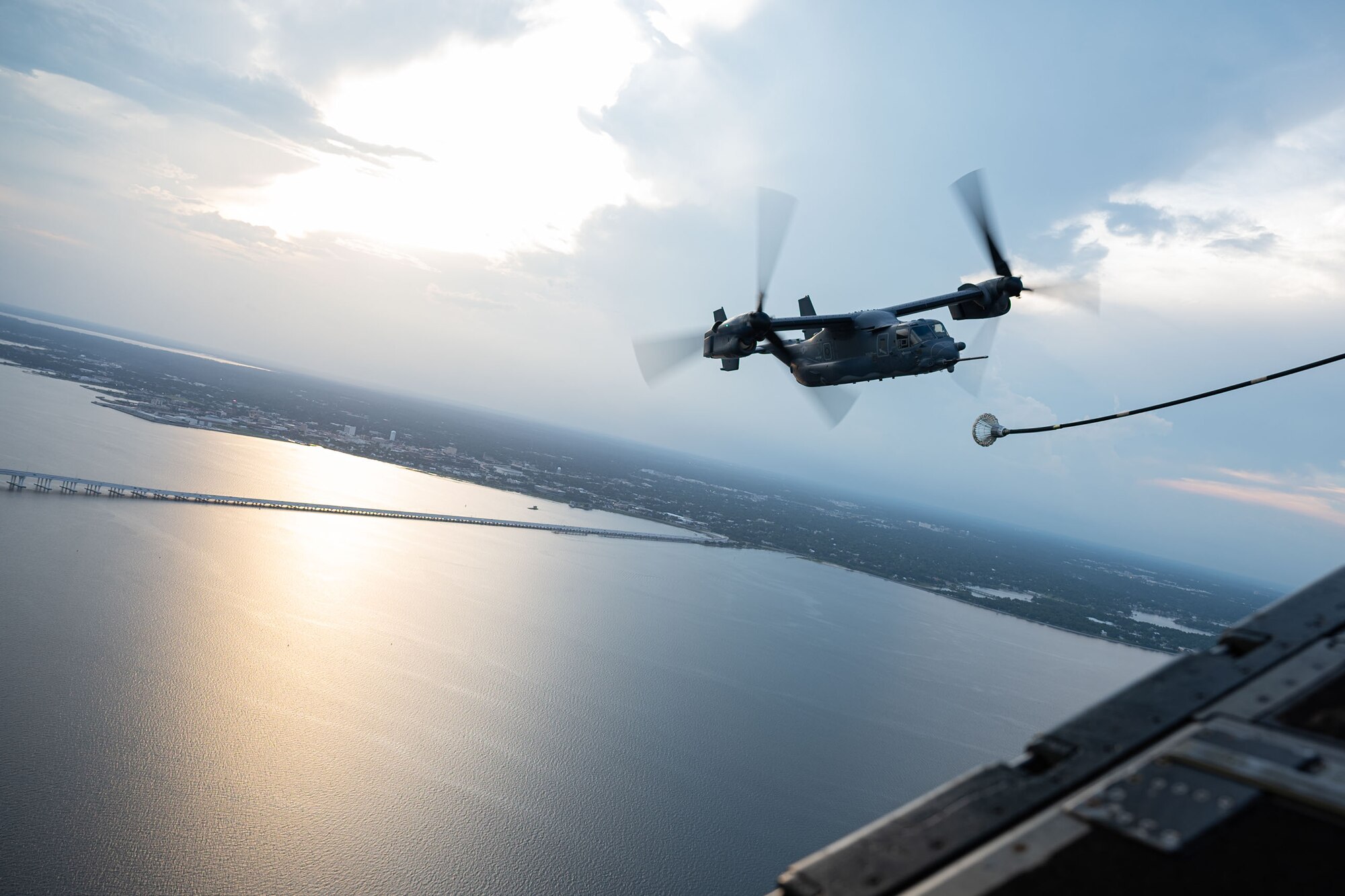 A CV-22 Osprey refuels from a MC-130J Commando II over the Emerald Coast.