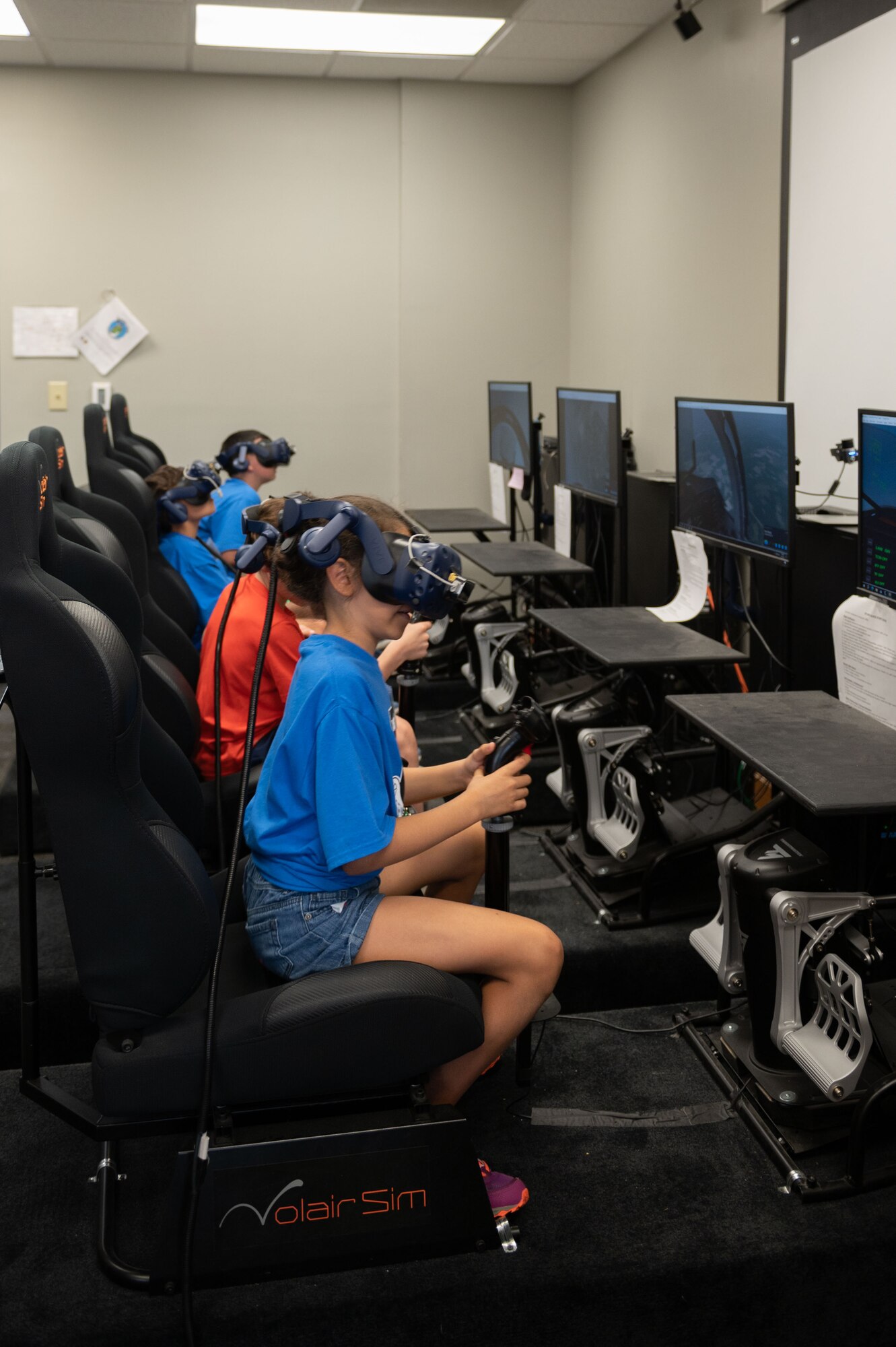 Wayne County students use the 4th Training Squadrons flight simulator during an Aerospace Camp community event at Seymour Johnson Air Force Base, North Carolina, June 22, 2023. The Aerospace Camp gave students an opportunity to meet Airmen who use science, technology, engineering and math (STEM) when performing their mission, and tour locations on base to learn how Team Seymour contributes to the Air Combat Command and U.S. Air Force mission. (U.S. Air Force photo by Airman 1st Class Rebecca Sirimarco-Lang)