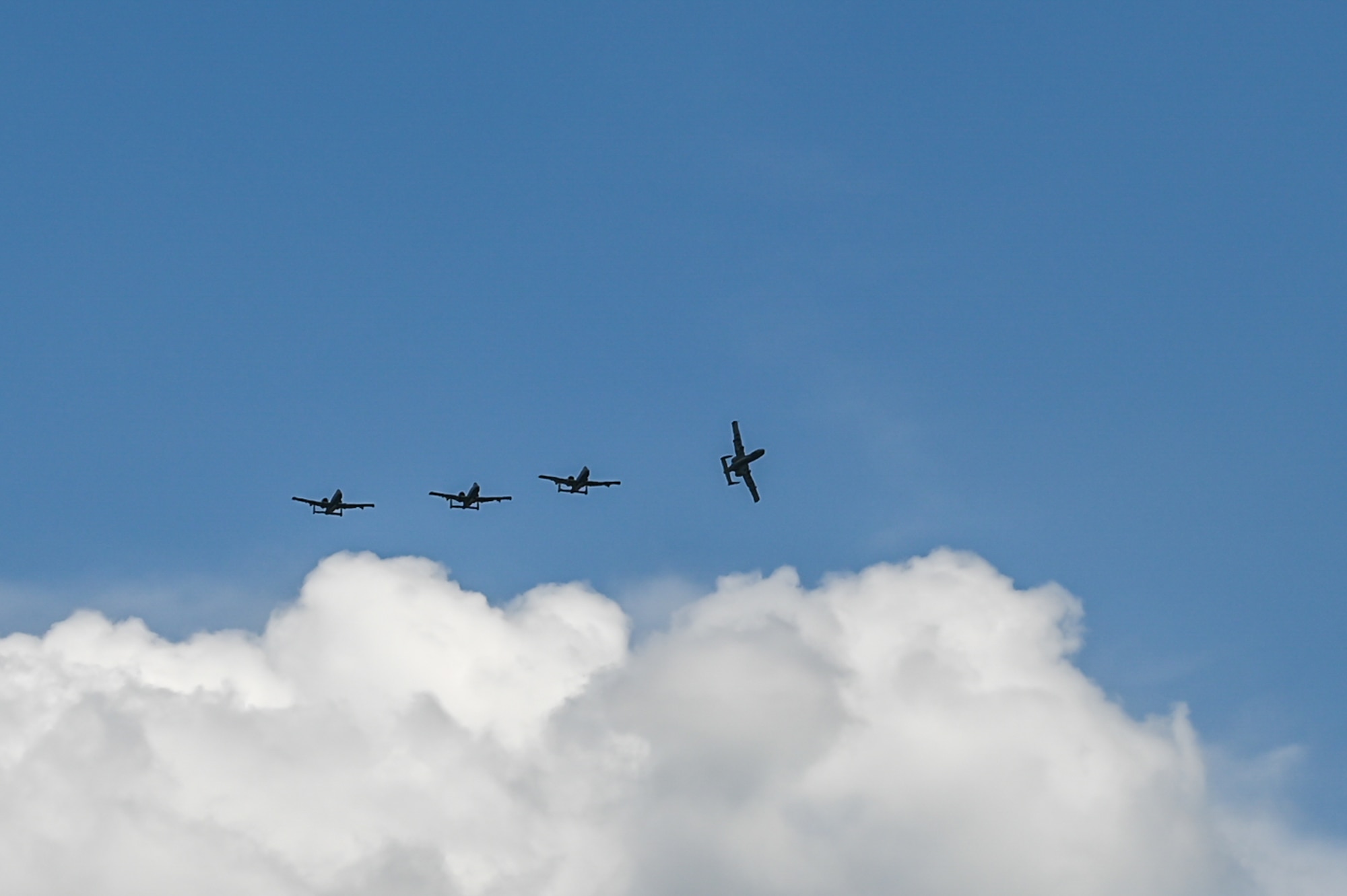 Four U.S. Air Force A-10C Thunderbolt II aircraft, assigned to the 104th Fighter Squadron, 175th Wing, Maryland National Guard, fly in formation for the final sortie of exercise Air Defender 2023 (AD 2023), June 22, 2023, at Jagel Air Base, Germany.