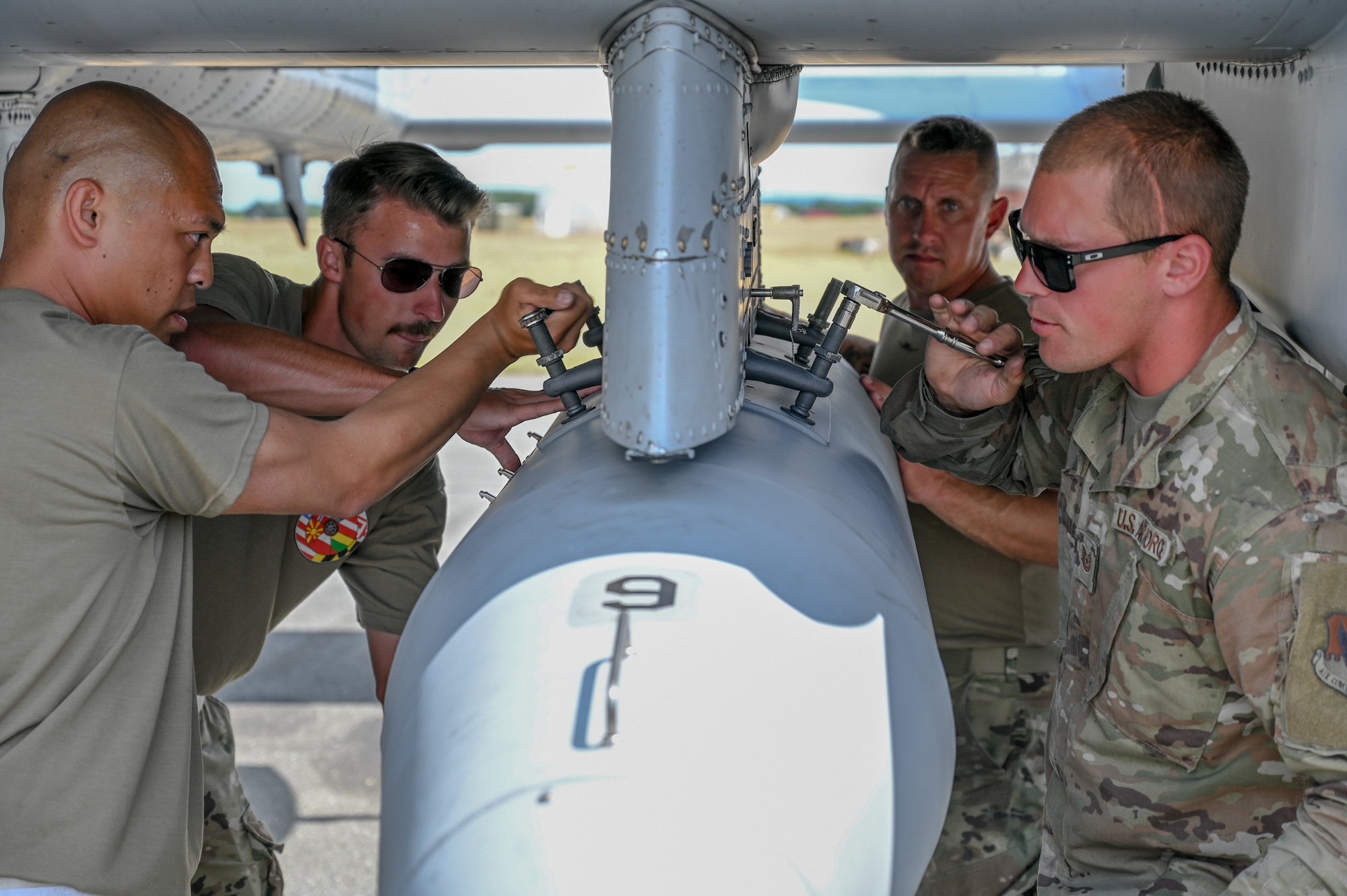 U.S. Air Force maintainers assigned to the 175th Aircraft Maintenance Squadron, 175th Wing, Maryland National Guard, install travel pods on an A-10C Thunderbolt II aircraft after their final training sortie during exercise Air Defender 2023 (AD23), June 22, 2023, at Jagel Air Base, Germany.