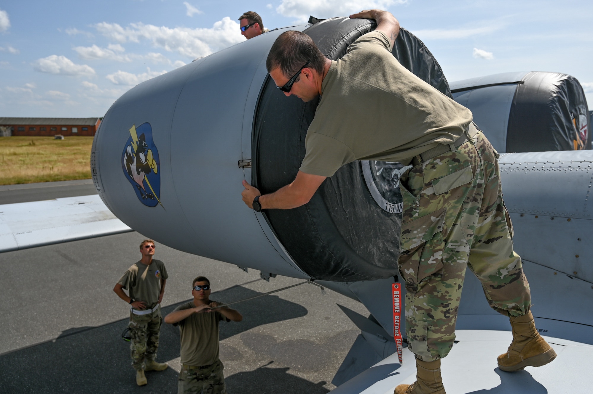 U.S. Air Force Master Sgt. Brendan Sedlak, a crew chief assigned to the 175th Aircraft Maintenance Squadron, 175th Wing, Maryland National Guard, puts an intake cover on an A-10C Thunderbolt II aircraft after the unit’s final training sortie during exercise Air Defender 2023 (AD23), June 22, 2023, at Jagel Air Base, Germany.