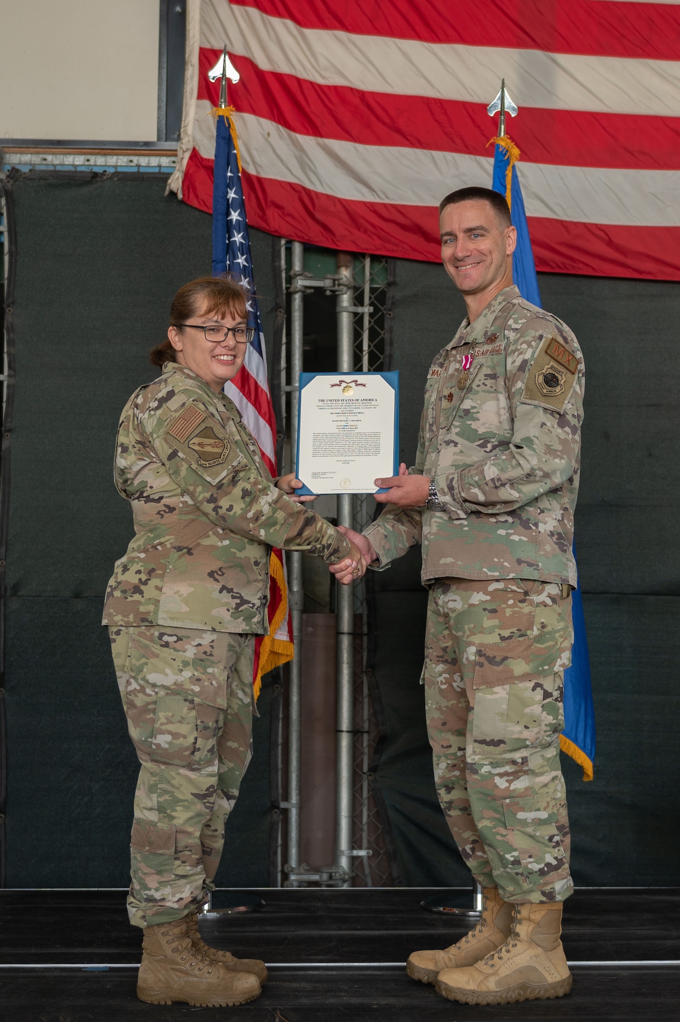 U.S. Air Force Col. Kathryn Roman, left, 4th Maintenance Group commander, awards the Meritorious Service Medal to U.S. Air Force Maj. Michael Makaryk, right, 335th Fighter Generation Squadron commander, during a change of command ceremony at Seymour Johnson Air Force Base, North Carolina, June 23, 2023. The Meritorious Service Medal is a military award presented to members of the United States Armed Forces who distinguished themselves by outstanding service. (U.S. Air Force photo by Airman 1st Class Rebecca Sirimarco-Lang)