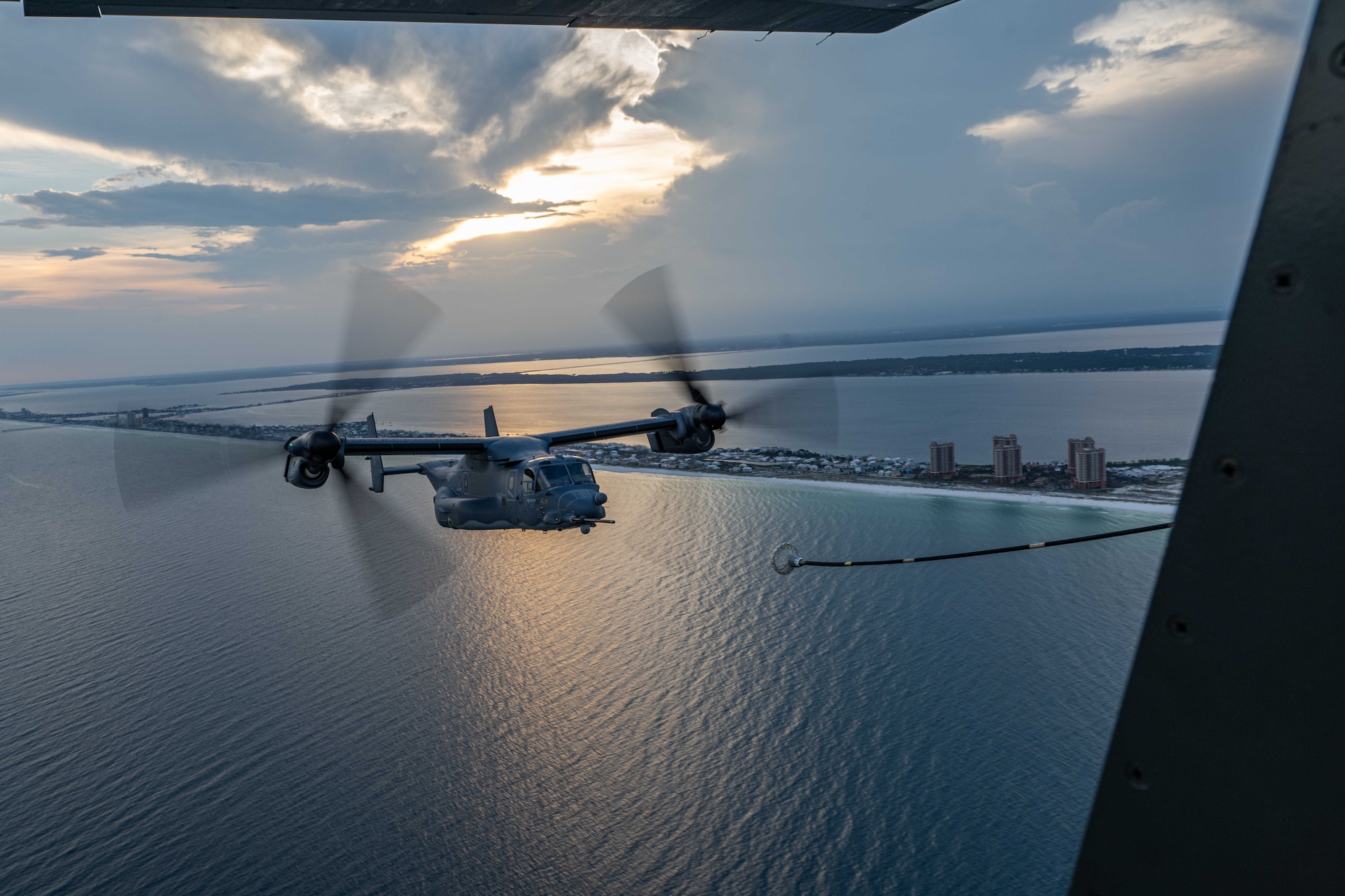 A CV-22 Osprey refuels from a MC-130J Commando II over the Emerald Coast.