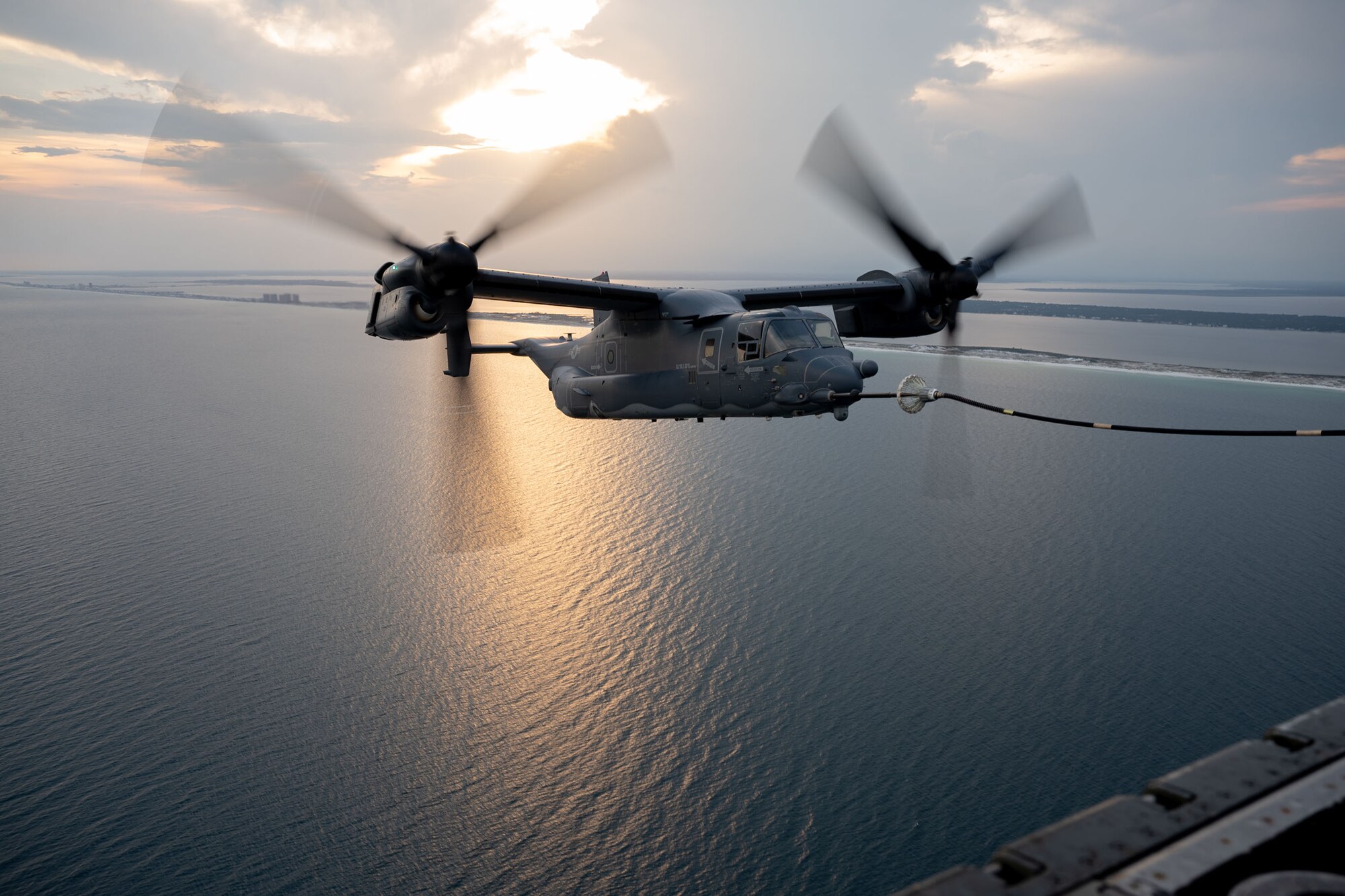 A CV-22 Osprey refuels from a MC-130J Commando II over the Emerald Coast.