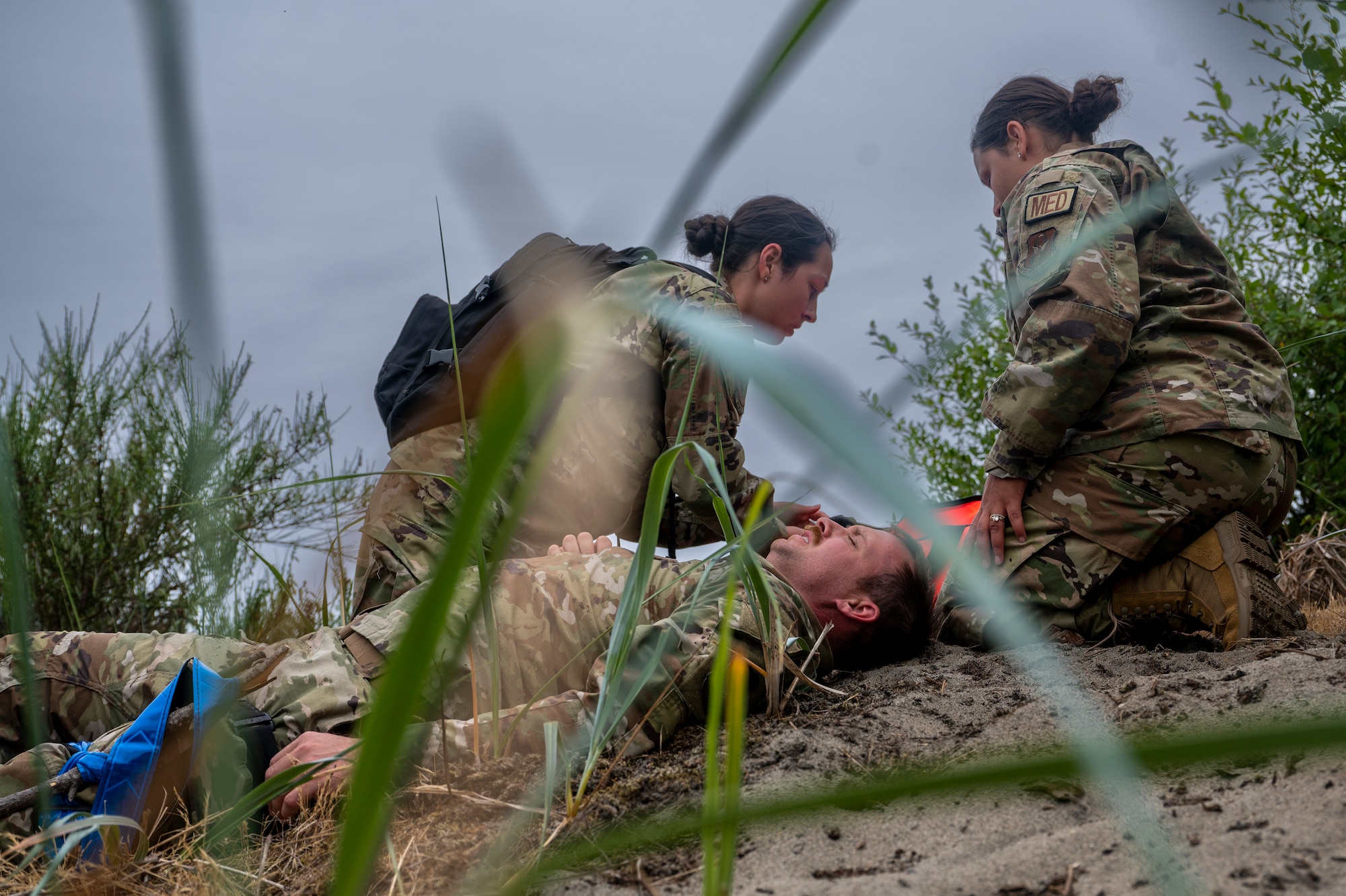 507th Medical Squadron Airmen evaluate a simulated patient for injuries during EXERCISE AGILE BLIZZARD-UNIFIED VISION 2023