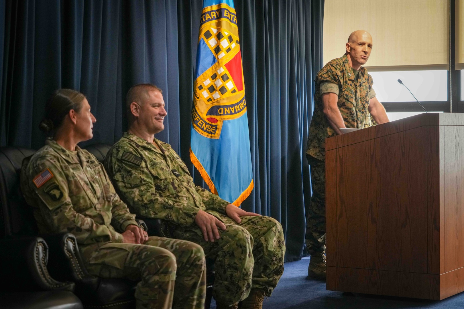 Marine Corps Col. Jesse Sjoberg, outgoing Western Sector commander, gives remarks during a change of command ceremony June 28.