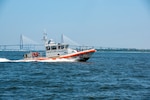 A Coast Guard Station Charleston 45-foot Response Boat-Medium boat crew participates in a mass rescue exercise in the Port of Charleston, South Carolina, June 28, 2023.