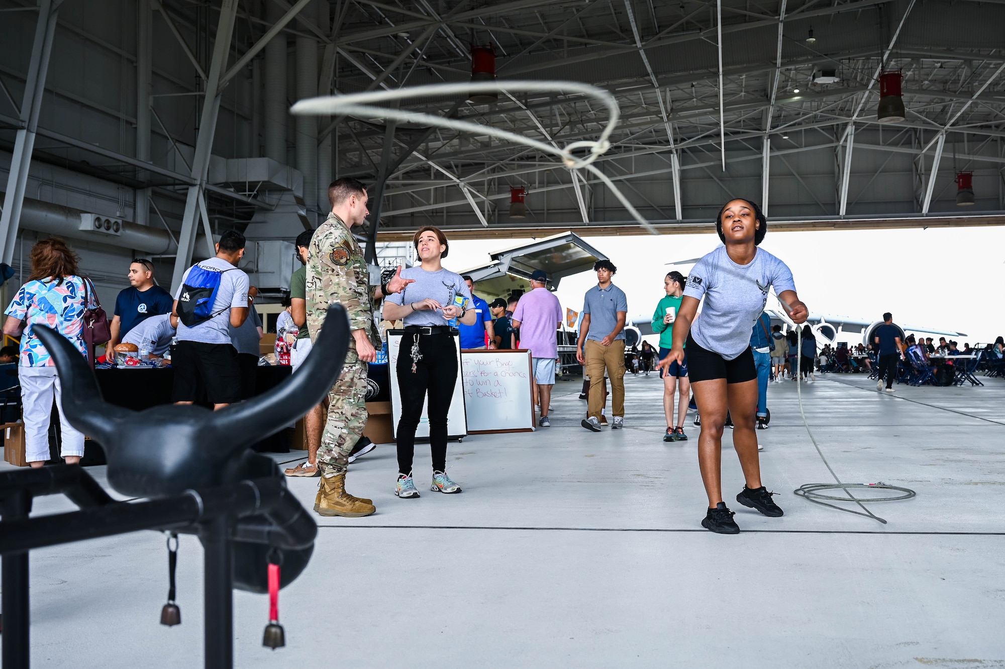 Tortavion Jamerson-Goode, 433rd Development & Training Flight member, throws a lasso at a roping steer head during 433rd Airlift Wing Family Day at Joint Base San Antonio-Lackland, Texas, May 7, 2023. The roping steer head booth was one of several activities at Family Day. (U.S. Air Force photo by Senior Airman Mark Colmenares)