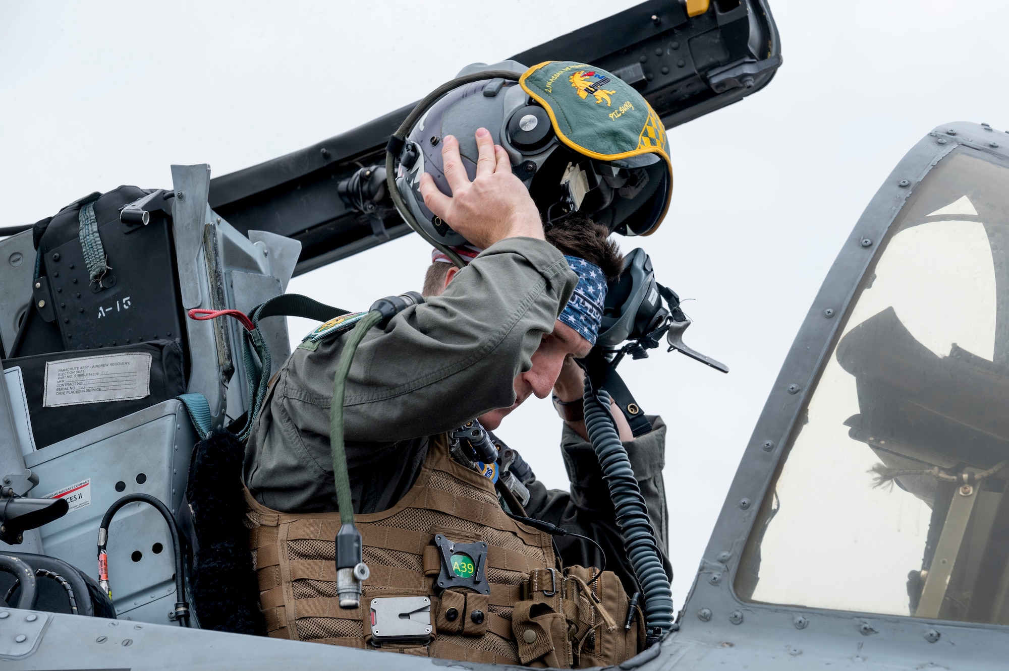 U.S. Air Force Capt. Zachary Kocur, 25th Fighter Squadron pilot, dons his helmet in an A-10C Thunderbolt II during the first day of Red Flag Alaska 23-2 at Eielson Air Force Base, Alaska, June 9, 2023.