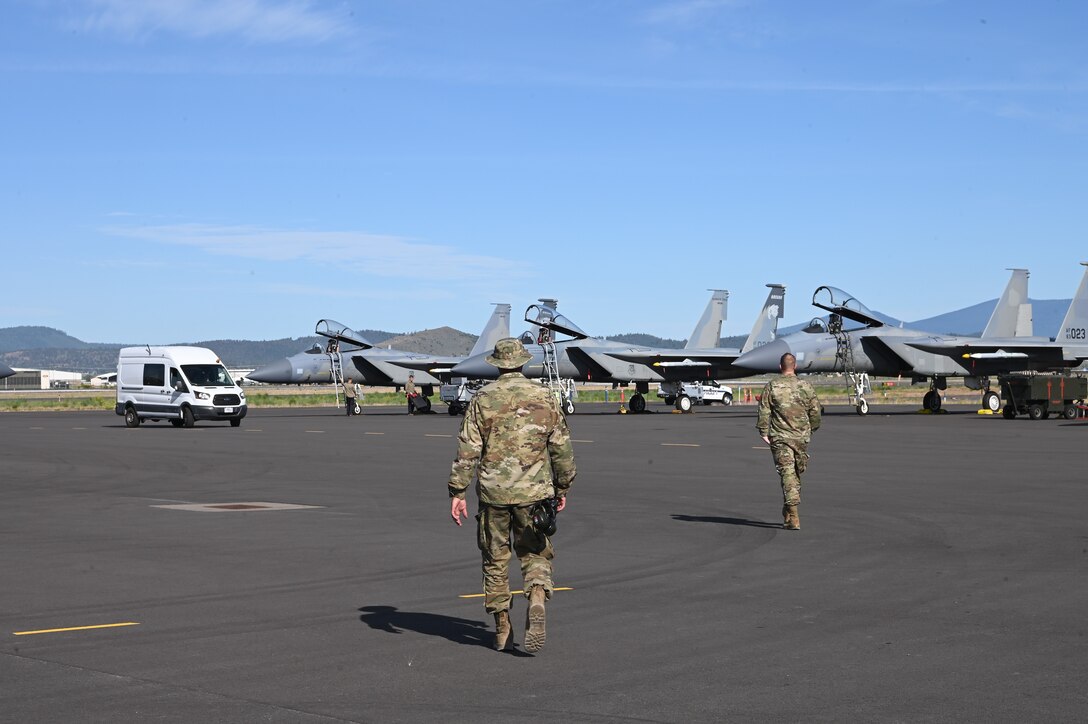 maintainers walking to F-15
