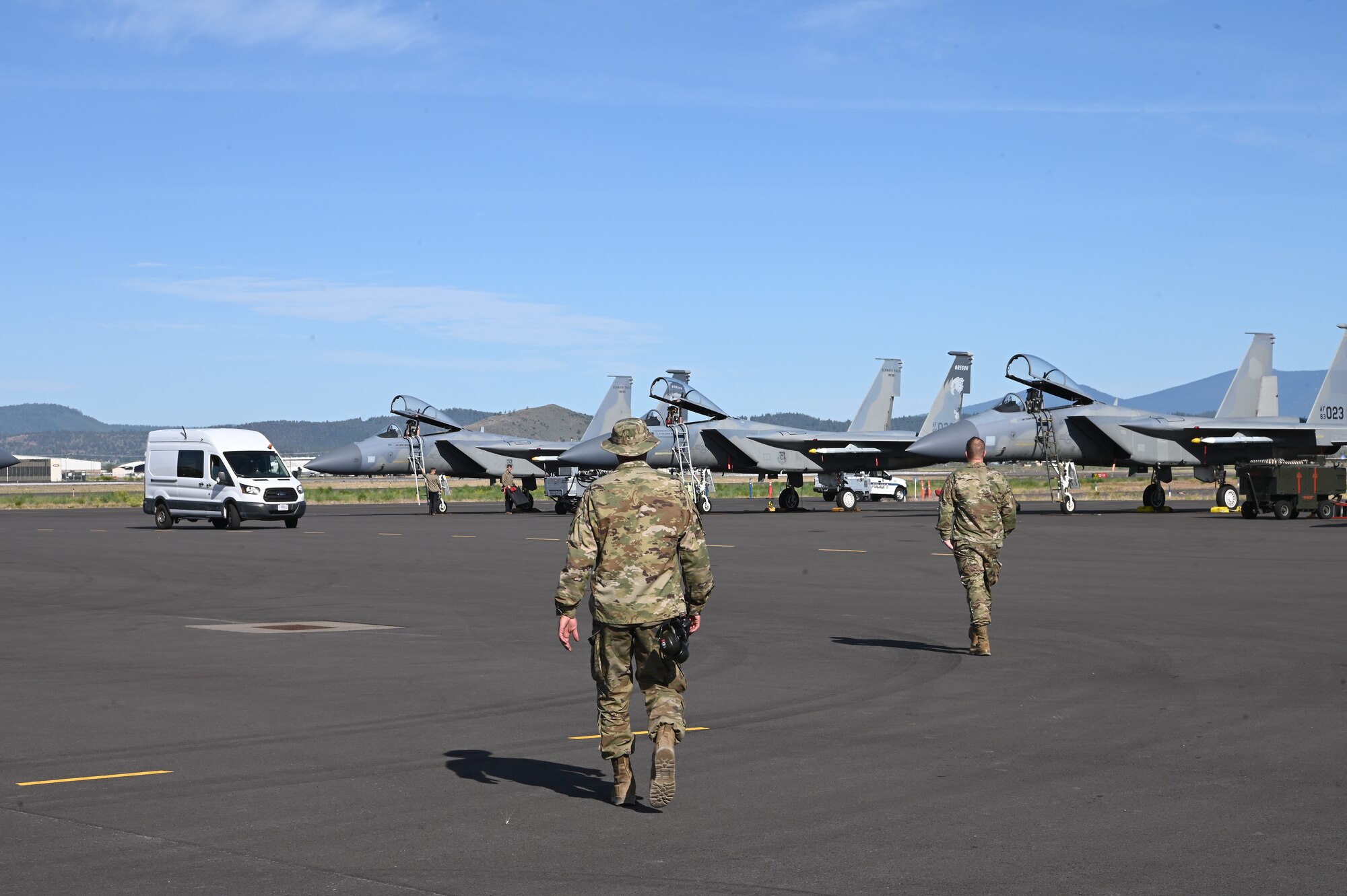 maintainers walking to F-15