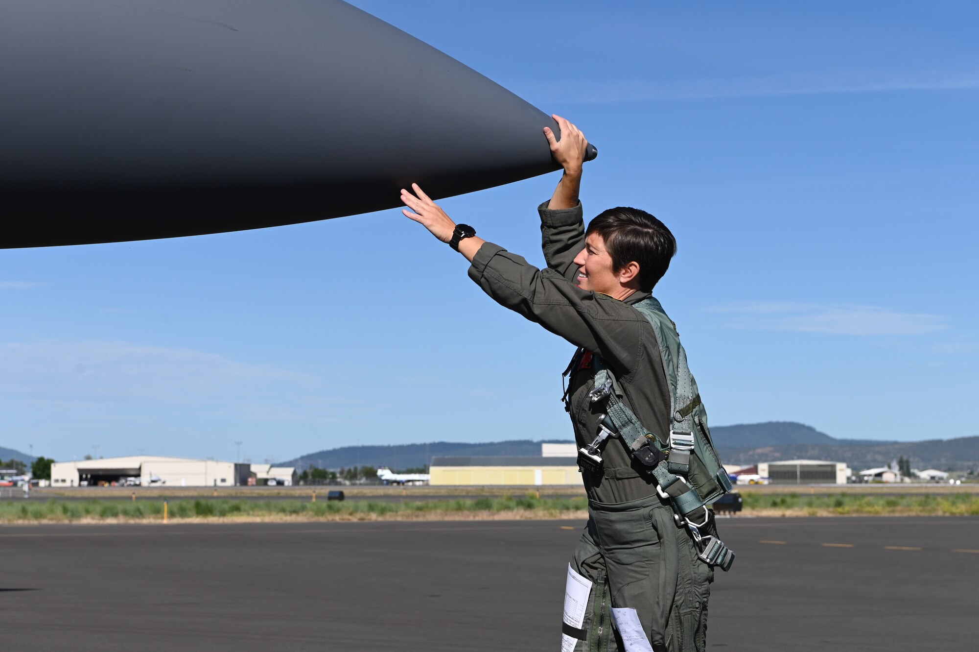 pilot touching nose of aircraft