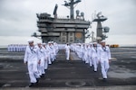 U.S. Navy Sailors prepare to man the rails of the aircraft carrier USS Nimitz (CVN 68). Nimitz arrives in San Diego concluding a seven-month deployment to U.S. 3rd and 7th Fleet areas of operations (AO). Nimitz’s presence in U.S. 3rd and 7th Fleet AOs reinforced the United States’ commitment to fly, sail and operate wherever international law allows in support of a free and open Indo-Pacific region.