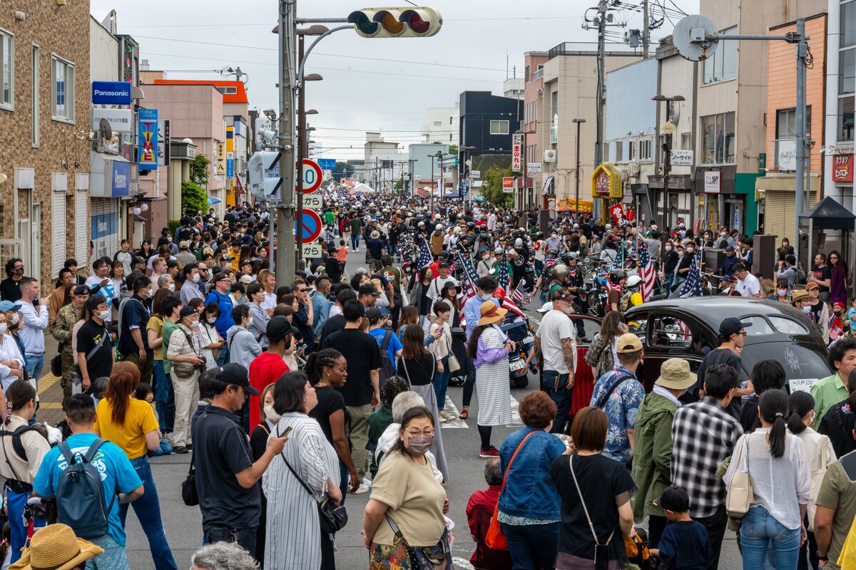 Japanese and Americans line the street, shoulder-to-shoulder, during American Day showcasing the strength of the U.S.-Japan Alliance in Misawa City, Japan, June 25, 2023. More than 50,000 attendees from across Japan traveled to Misawa City to enjoy and appreciate American and Japanese culture. (U.S. Air Force photo by Staff Sgt. Kristen Heller)