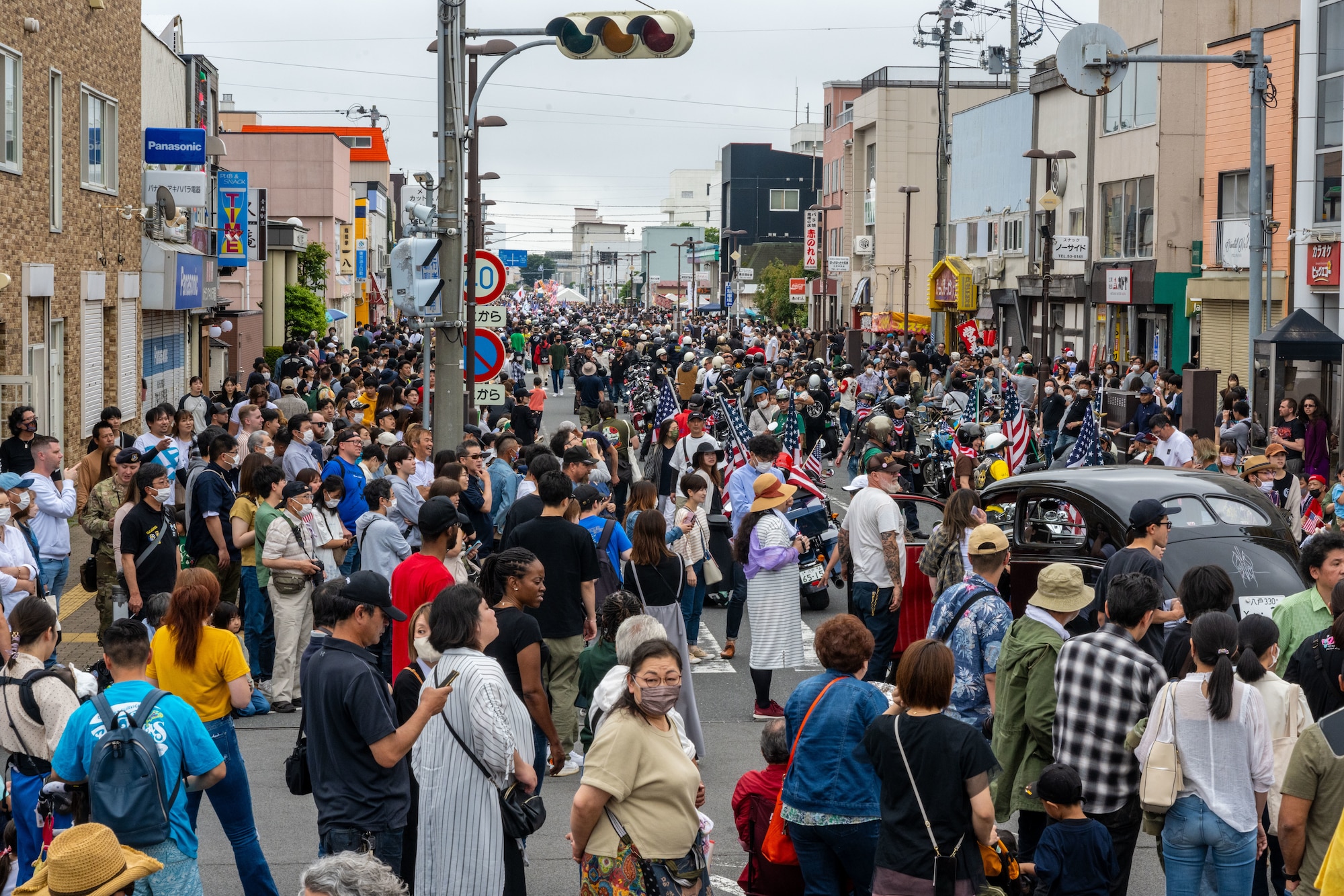 Japanese and Americans line the street, shoulder-to-shoulder, during American Day showcasing the strength of the U.S.-Japan Alliance in Misawa City, Japan, June 25, 2023. More than 50,000 attendees from across Japan traveled to Misawa City to enjoy and appreciate American and Japanese culture. (U.S. Air Force photo by Staff Sgt. Kristen Heller)
